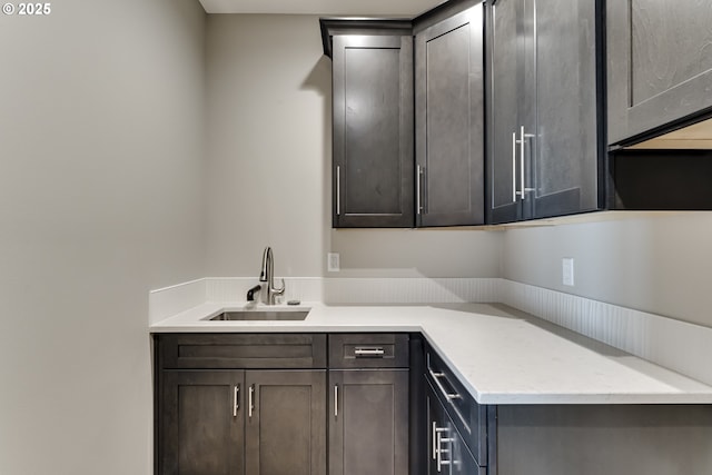 kitchen with sink and dark brown cabinets