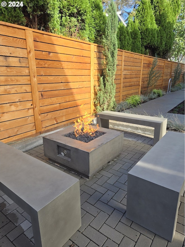 view of patio / terrace with an outdoor fire pit