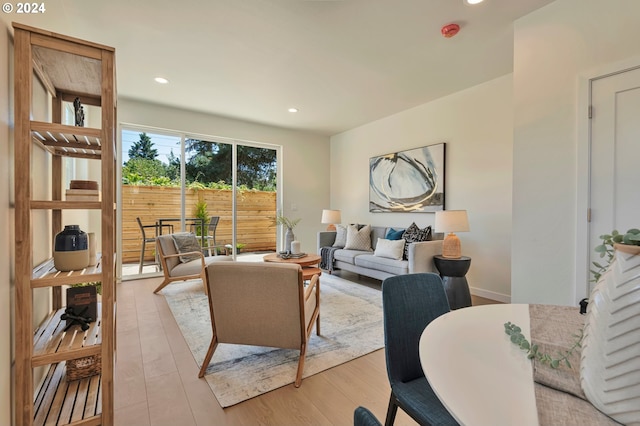 living room with light hardwood / wood-style flooring