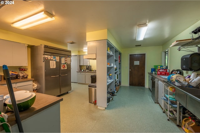 kitchen featuring built in refrigerator