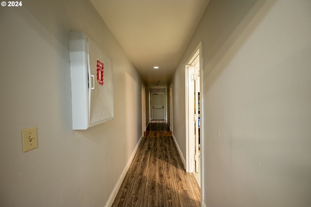 corridor with wood-type flooring