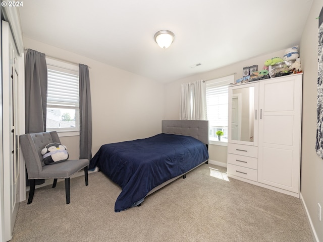 bedroom with light carpet