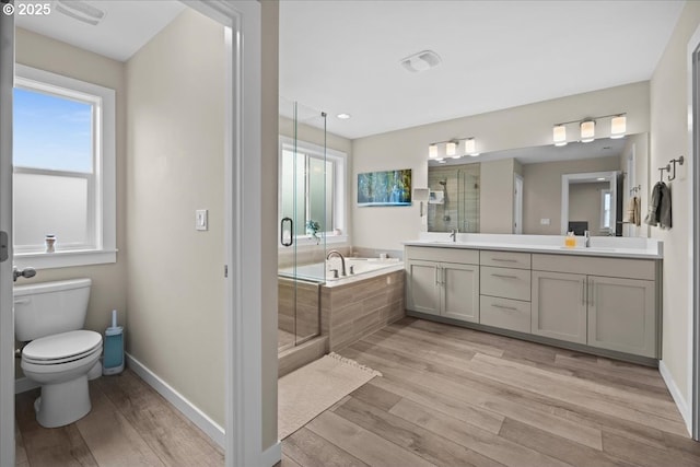 2410 S Heather St, Cornelius, OR 97113 - full bath featuring double vanity, a bath, a shower stall, toilet, and wood finished floors