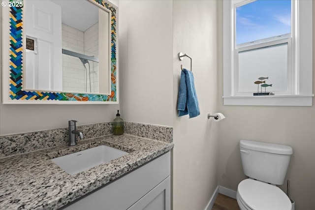 2410 S Heather St, Cornelius, OR 97113 - bathroom featuring vanity, toilet, a tile shower, and baseboards