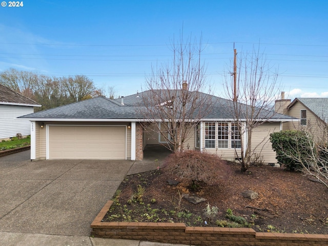 ranch-style house featuring a garage