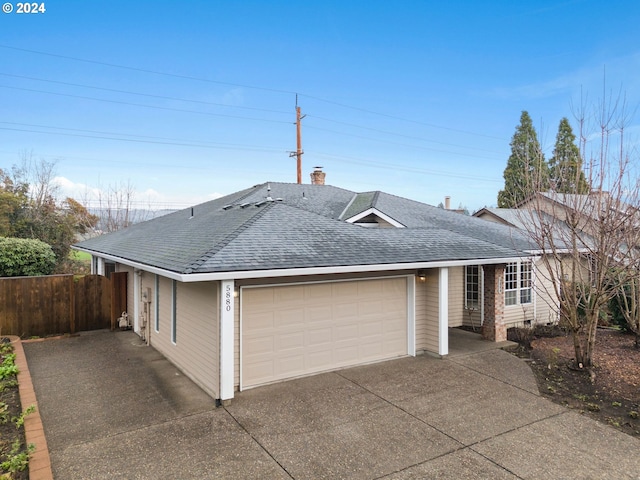 ranch-style house featuring a garage