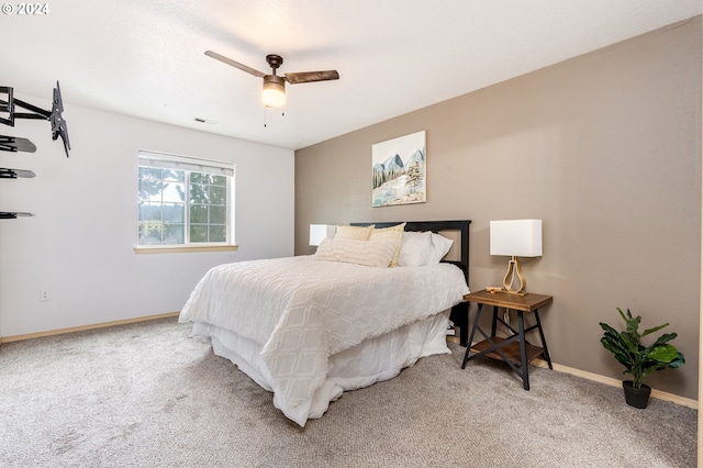 bedroom with ceiling fan and carpet