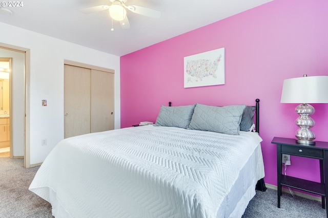 carpeted bedroom featuring ceiling fan and a closet