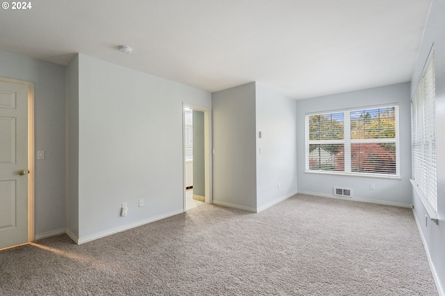 unfurnished room with carpet