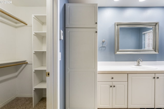 bathroom featuring vanity and baseboards