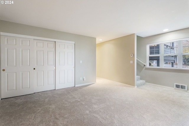 interior space featuring visible vents, recessed lighting, carpet floors, and stairway