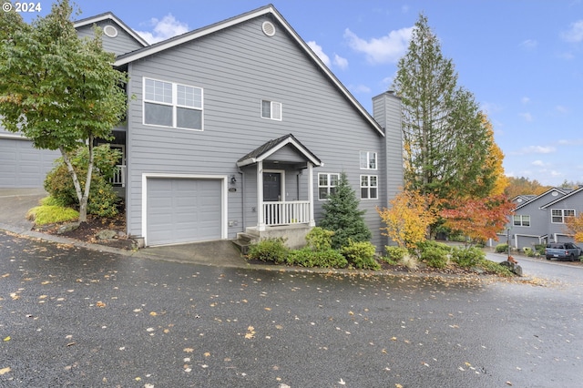 view of front of property featuring a garage and a chimney