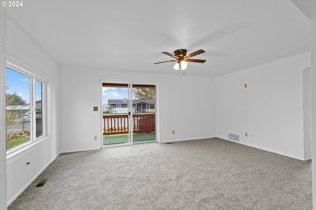 empty room with carpet and ceiling fan