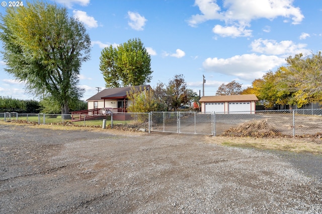 1655 NE 2nd St, Hermiston, OR 97838 - view of front of house featuring a garage, a gate, and fence