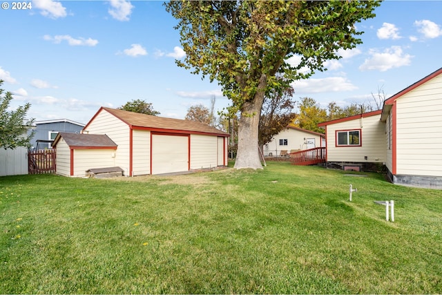 view of yard featuring an outbuilding and a garage