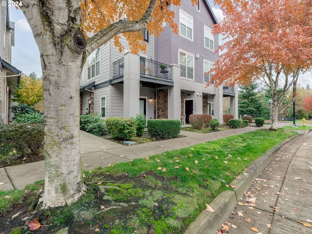 view of front of home with a balcony