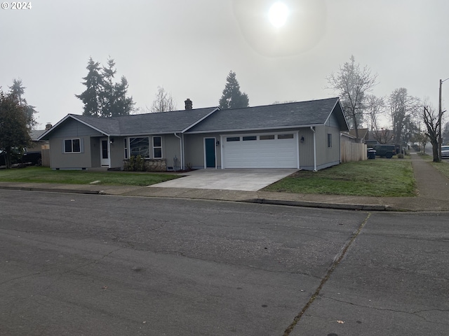 ranch-style house with a front lawn and a garage