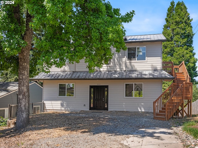 back of house featuring a deck