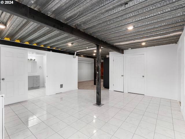 basement with light tile patterned floors