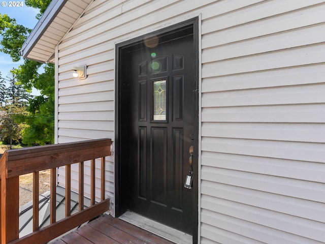 entrance to property featuring a deck