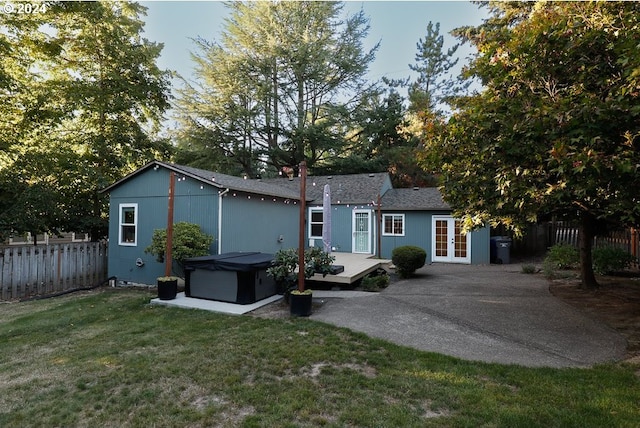 view of front of house featuring a front lawn and a patio