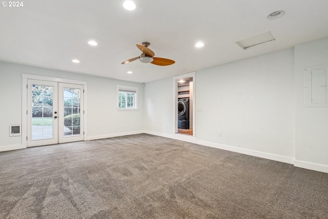 carpeted spare room with washer / clothes dryer, ceiling fan, and heating unit