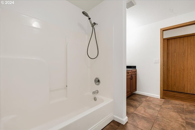 bathroom featuring vanity, tile patterned flooring, and shower / bathtub combination