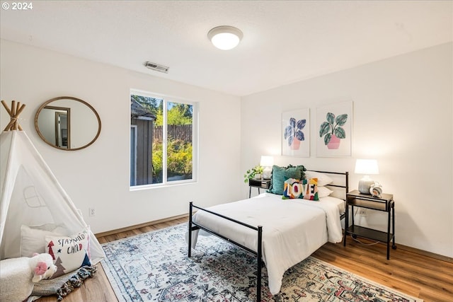 bedroom featuring hardwood / wood-style flooring