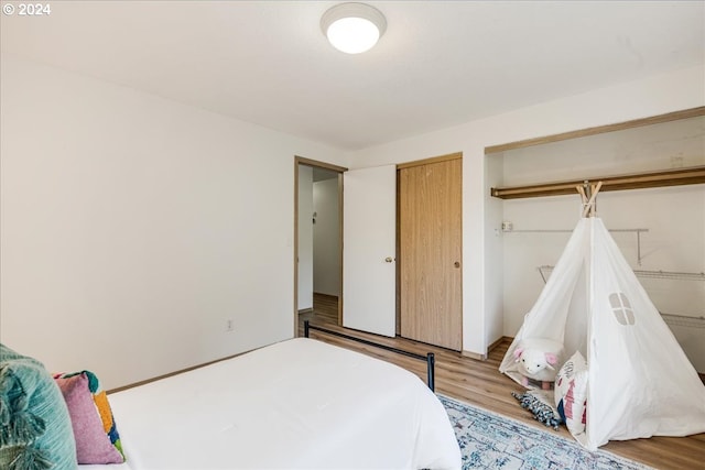 bedroom with light hardwood / wood-style floors