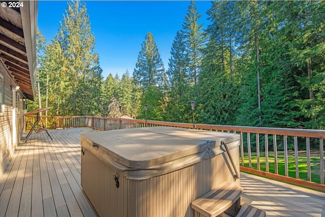 wooden terrace with a hot tub