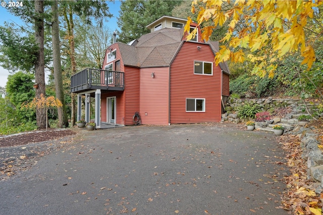 view of side of property with a deck