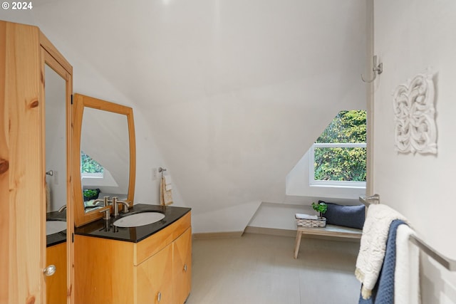 7184 Battle Creek Rd, Salem, OR 97317 - bathroom with vaulted ceiling, vanity, and baseboards