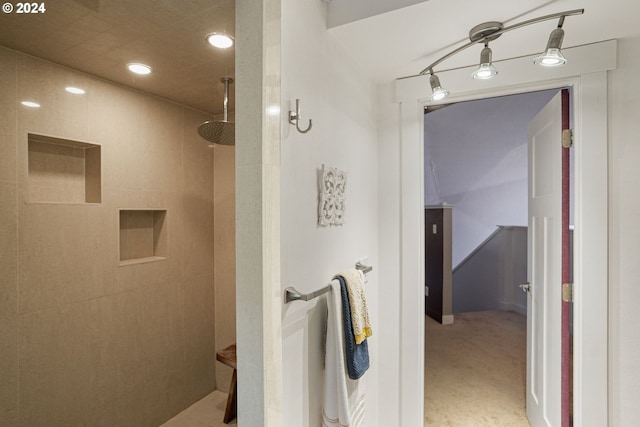 bathroom with a tile shower