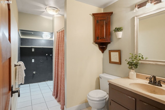 bathroom featuring tile patterned floors, vanity, and toilet