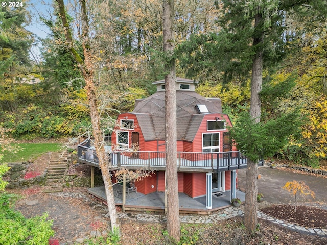 7184 Battle Creek Rd, Salem, OR 97317 - rear view of house with a deck, a gambrel roof, and a shingled roof