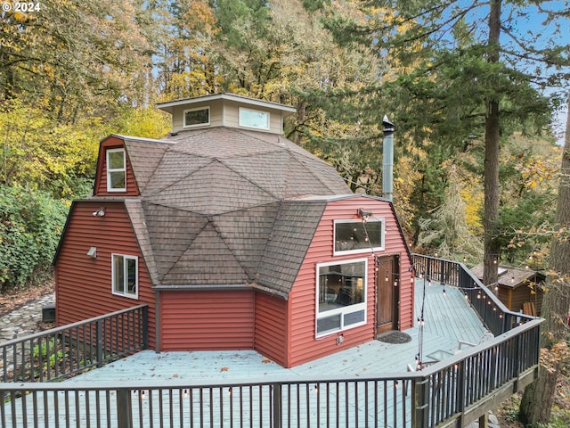 rear view of property with a deck