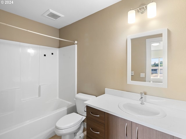 full bathroom with bathing tub / shower combination, vanity, and toilet