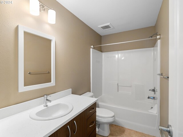 full bathroom featuring tile patterned flooring, vanity, toilet, and shower / tub combination