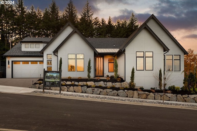 modern farmhouse with a garage