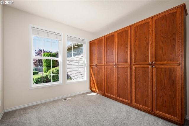 empty room with light colored carpet