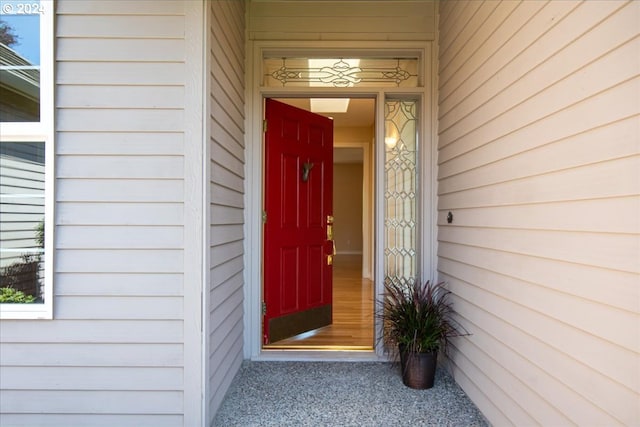 foyer entrance featuring light colored carpet