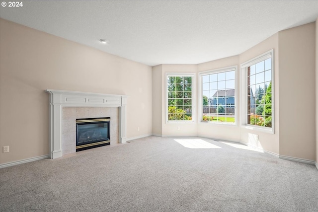 interior space featuring a chandelier, a fireplace, and carpet floors