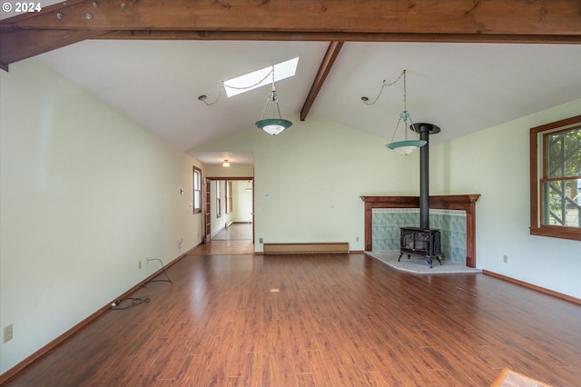 unfurnished living room featuring a wood stove, lofted ceiling with skylight, wood-type flooring, and a baseboard radiator