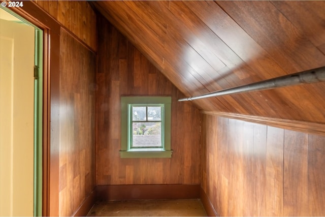 bonus room featuring wood walls, wood ceiling, and vaulted ceiling