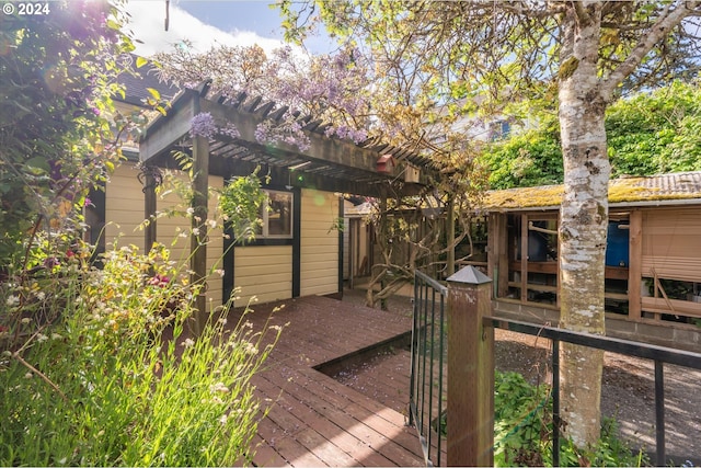 exterior space featuring a pergola and a deck