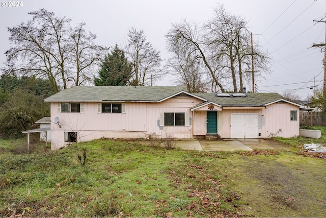 view of front of house with a patio and a front lawn