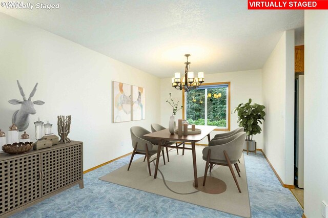 carpeted dining area featuring an inviting chandelier