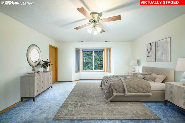 bedroom with carpet floors, ceiling fan, and baseboards