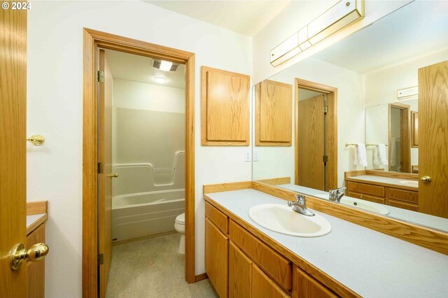 full bathroom featuring vanity, toilet, and tub / shower combination