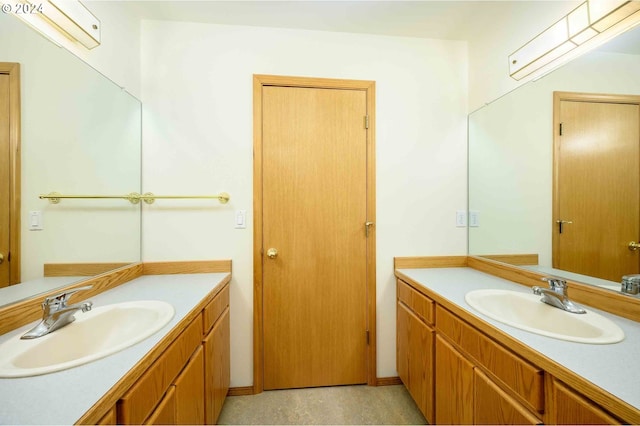 bathroom with two vanities and a sink